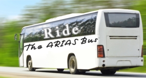 White bus with Ride the ARIAS bus written on the side